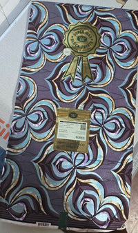 Purple, blue and gold floral Golden Wax Vlisco print with seal and label